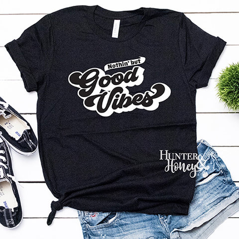 Good Vibes Only black graphic tee with white retro lettering.