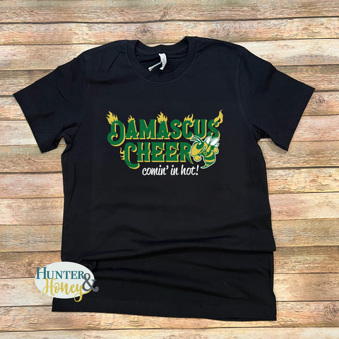 A black cotton t-shirt with a 3-color logo that reads Damascus Cheer Comin' in Hot with a hornet.