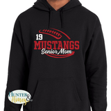 A black hooded sweatshirt with a two-color red and white glitter football graphic that has Mustangs Senior Mom cutting through the middle of the football. It is customizable with a player's jersey number above the word Mustangs.