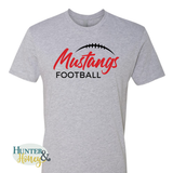 A heather gray short-sleeve t-shirt with a graphic on the chest that reads 'Mustangs FOOTBALL' in red and black, featuring a black football outline above the text. A Hunter & Honey logo watermark is visible in the bottom-left corner.