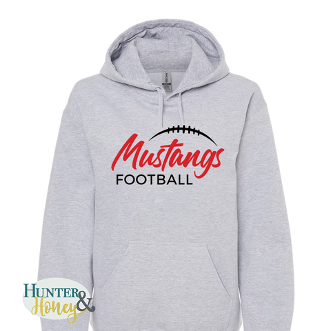 An athletic heather gray pullover hoodie with a front kangaroo pocket and a graphic print that reads 'Mustangs FOOTBALL' in red and black HTV, featuring a football outline above the text. A Hunter & Honey watermark is visible in the bottom-left corner.