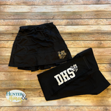 Black skirt and shorts with 'DHS' logo on a wooden surface, brand 'Hunter & Honey' visible.