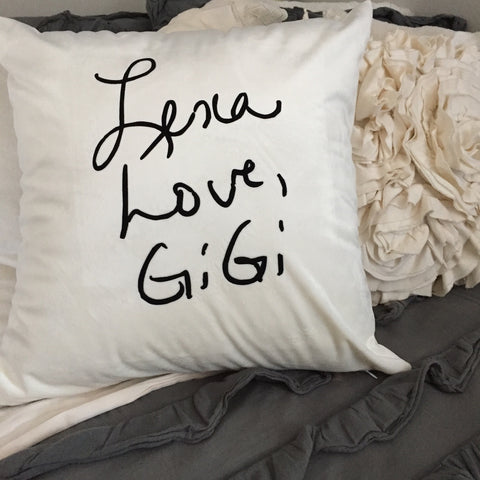 A white velvet pillow cover with black text in your own handwriting